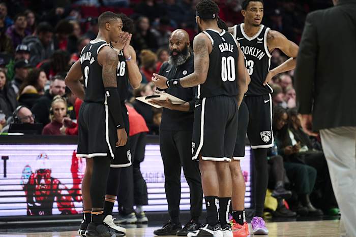 Brooklyn Nets head coach Jacque Vaughn meets with players during a time out in the second half against the Portland Trail Blazers